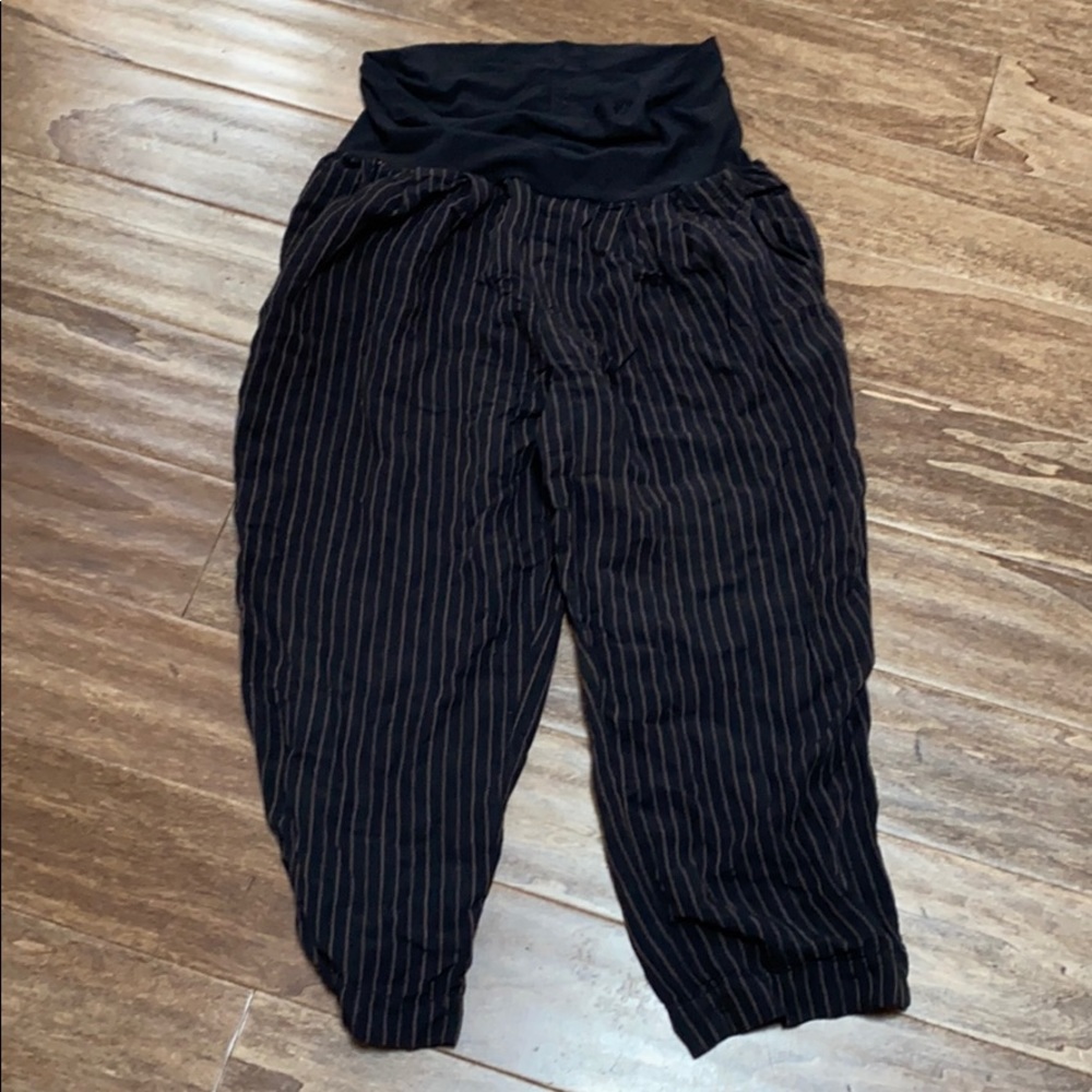 Black striped parachute pants.
